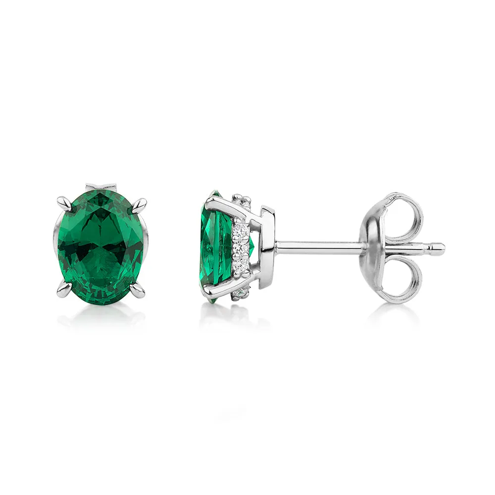 Oval and Round Brilliant stud earrings with emerald and diamond simulants in sterling silver